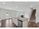 Open concept kitchen with stainless steel appliances and granite countertops at 96 Quail Bend Way, Dallas, GA 30157