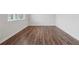 Well-lit living area with hardwood floors, white walls, and ample space for furniture at 96 Quail Bend Way, Dallas, GA 30157