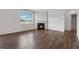 Bright living room featuring a cozy fireplace and hardwood floors at 96 Quail Bend Way, Dallas, GA 30157
