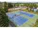 Aerial view of the community tennis courts with playground and pool in the background at 96 Quail Bend Way, Dallas, GA 30157