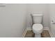 Close-up of a white toilet in a modern bathroom with tile flooring at 96 Quail Bend Way, Dallas, GA 30157