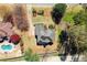 Aerial view of the property with a pool and well-maintained backyard at 13090 Magnolia Crescent Dr, Roswell, GA 30075