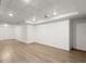 Spacious unfinished basement showcasing laminate flooring and recessed lighting at 13090 Magnolia Crescent Dr, Roswell, GA 30075