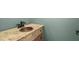 Charming half-bath features an antique vanity and distressed wood finish at 13090 Magnolia Crescent Dr, Roswell, GA 30075