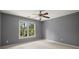 A carpeted bedroom with a view of the backyard at 13090 Magnolia Crescent Dr, Roswell, GA 30075