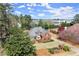 Charming brick home with manicured lawn, mature trees, and well-kept landscaping in a peaceful neighborhood setting at 13090 Magnolia Crescent Dr, Roswell, GA 30075