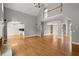 Spacious living room features hardwood floors, high ceilings, and an open layout, perfect for entertaining at 13090 Magnolia Crescent Dr, Roswell, GA 30075