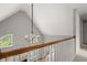 Stairwell showcasing a chandelier, high ceilings, and a view of the living area at 13090 Magnolia Crescent Dr, Roswell, GA 30075