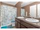 Bathroom featuring double sinks, granite countertops, and a shower-tub combo at 1152 Werre Way, Locust Grove, GA 30248