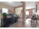 Home office leading into the living room with a view of comfortable sofas at 1152 Werre Way, Locust Grove, GA 30248