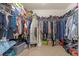 Walk-in closet equipped with lots of clothing at 1152 Werre Way, Locust Grove, GA 30248