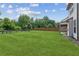 Green grass and a wooden fence highlight this large backyard at 4650 Orchard View Way, Cumming, GA 30028