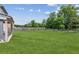A sprawling green backyard with a wooden fence and green trees at 4650 Orchard View Way, Cumming, GA 30028