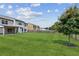 A spacious and green backyard with wooden fence, trees and patio at 4650 Orchard View Way, Cumming, GA 30028