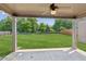 A new backyard view from the patio with green grass, trees and a fence at 4650 Orchard View Way, Cumming, GA 30028
