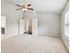 Bedroom showcasing neutral carpet, ceiling fan, recessed lighting, and access to ensuite bathroom at 4650 Orchard View Way, Cumming, GA 30028