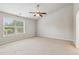 Bedroom featuring neutral carpet, ceiling fan and one window allowing plenty of natural light at 4650 Orchard View Way, Cumming, GA 30028