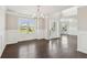 Welcoming entryway with hardwood floors, decorative trim, and natural light from the windows at 4650 Orchard View Way, Cumming, GA 30028