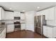 Bright kitchen with stainless steel appliances, white cabinets, and granite countertops at 4650 Orchard View Way, Cumming, GA 30028