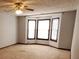 Bedroom featuring a cozy bay window, creating a bright and inviting space at 542 Banks E Rd, Fayetteville, GA 30214