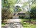 Charming two-story home with a two-car garage, well-manicured lawn, and beautiful surrounding trees at 542 Banks E Rd, Fayetteville, GA 30214