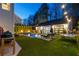 Expansive backyard featuring a sparkling pool, lounge area, and a versatile ping pong table for leisure and recreation at 7165 Cordery Rd, Cumming, GA 30040