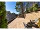 Private backyard basketball court with brick pavers and shady seating, perfect for sports and relaxation at 7165 Cordery Rd, Cumming, GA 30040