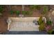 Aerial view of private basketball court with brick retaining wall at 7165 Cordery Rd, Cumming, GA 30040
