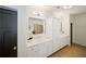Bright bathroom with double vanities, white cabinets, and modern fixtures at 7165 Cordery Rd, Cumming, GA 30040