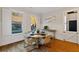 Charming breakfast nook with natural light, wainscoting, and stylish round table at 7165 Cordery Rd, Cumming, GA 30040