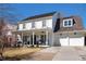 Beautiful home with a manicured lawn and a charming front porch, creating a welcoming curb appeal at 7165 Cordery Rd, Cumming, GA 30040