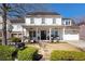 Charming two-story home with a welcoming front porch, swing, and meticulously maintained landscaping at 7165 Cordery Rd, Cumming, GA 30040