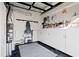 Organized garage space with ample storage cabinets and pegboard, ideal for hobbies, projects, and a clean look at 7165 Cordery Rd, Cumming, GA 30040