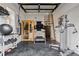 Well-equipped home gym with a sauna, treadmill, weights, and shiplap walls, promoting a healthy lifestyle at 7165 Cordery Rd, Cumming, GA 30040