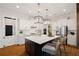 Well-appointed kitchen with a large center island, stainless steel appliances, and modern fixtures at 7165 Cordery Rd, Cumming, GA 30040