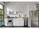 Beautiful kitchen with white cabinets, stainless steel appliances, farmhouse sink, and ample counter space at 7165 Cordery Rd, Cumming, GA 30040