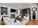 Bright living room with fireplace, stylish decor, comfortable seating, and view to patio at 7165 Cordery Rd, Cumming, GA 30040