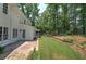Large backyard with patio area and privacy fence with lush, mature trees at 863 Fairlong Nw Way, Acworth, GA 30101