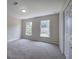 Bright bedroom with neutral walls, carpeted floor, and double windows offering natural light at 863 Fairlong Nw Way, Acworth, GA 30101
