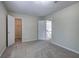 Bedroom with neutral walls, carpet, natural light, closet, and view to the upstairs hall at 863 Fairlong Nw Way, Acworth, GA 30101