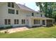 Rear exterior of a home with a covered porch, patio, and nicely manicured lawn at 863 Fairlong Nw Way, Acworth, GA 30101