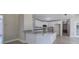 Modern kitchen featuring an island with granite countertop, white cabinets, stainless steel appliances, and tile flooring at 863 Fairlong Nw Way, Acworth, GA 30101