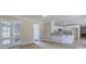Modern kitchen featuring an island with granite countertop, white cabinets, stainless steel appliances, and tile flooring at 863 Fairlong Nw Way, Acworth, GA 30101