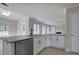Modern kitchen with an island, granite countertops, white cabinets, and stainless steel appliances at 863 Fairlong Nw Way, Acworth, GA 30101