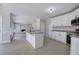 Open-concept kitchen with an island that connects seamlessly to the adjacent living space at 863 Fairlong Nw Way, Acworth, GA 30101