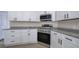Modern kitchen featuring white cabinets, stainless steel appliances, granite countertops and stainless steel appliances at 863 Fairlong Nw Way, Acworth, GA 30101