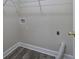 Practical laundry room with new flooring and essential hookups, blending function with a clean design at 863 Fairlong Nw Way, Acworth, GA 30101
