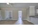 The brightly lit living room provides tile floors and flows to other parts of the home through multiple doors at 863 Fairlong Nw Way, Acworth, GA 30101