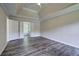 Spacious main bedroom with a tray ceiling and a clear view to the ensuite bathroom at 863 Fairlong Nw Way, Acworth, GA 30101