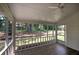 Relaxing screened porch with ceiling fan and view of private backyard at 863 Fairlong Nw Way, Acworth, GA 30101